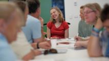 Group of people sitting at a table talking